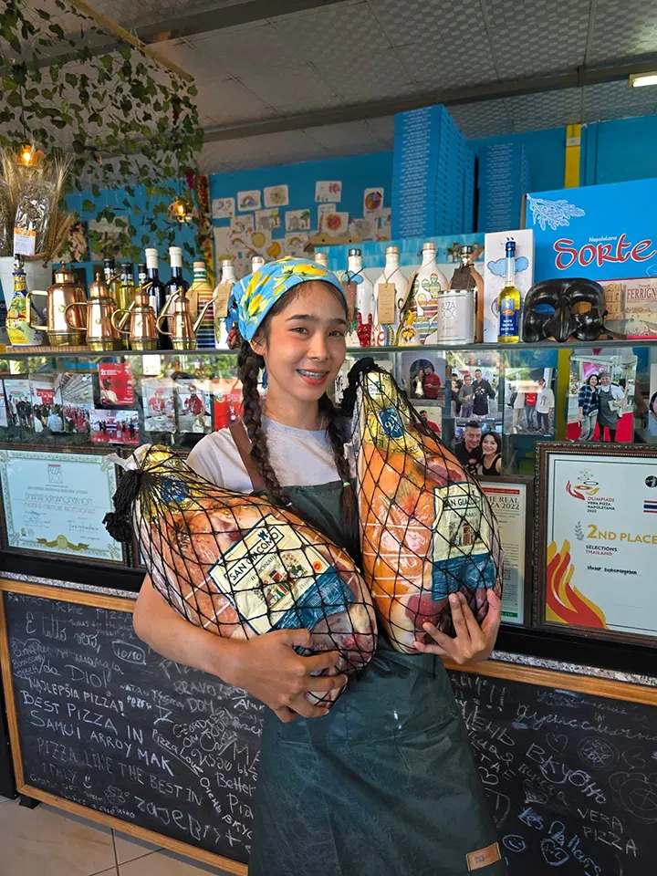 Authentic Parma Ham sliced fresh in-house Staff handling Parma ham